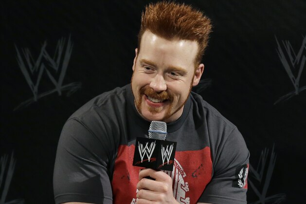 WWE wrestling star Stephen Farrelly,  of Ireland, know as Sheamus, smiles as he answers a question during a news conference Sunday, April 7, 2013, in East Rutherford, N.J., ahead of Sunday's WWE Wrestlemania 29. (AP Photo/Mel Evans)