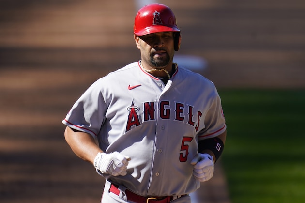 Los Angeles Angels first baseman Albert Pujols (5) in the eighth inning of a baseball game Sunday, Sept. 13, 2020, in Denver. (AP Photo/David Zalubowski) Los Angeles Angels first baseman Albert Pujols (5) in the eighth inning of a baseball game Sunday, Sept. 13, 2020, in Denver. (AP Photo/David Zalubowski)
