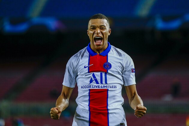 PSG's Kylian Mbappe celebrates after scoring his side's second goal during the Champions League round of 16, first leg soccer match between FC Barcelona and Paris Saint-Germain at the Camp Nou stadium in Barcelona, Spain, Tuesday, Feb. 16, 2021. (AP Photo/Joan Monfort)
