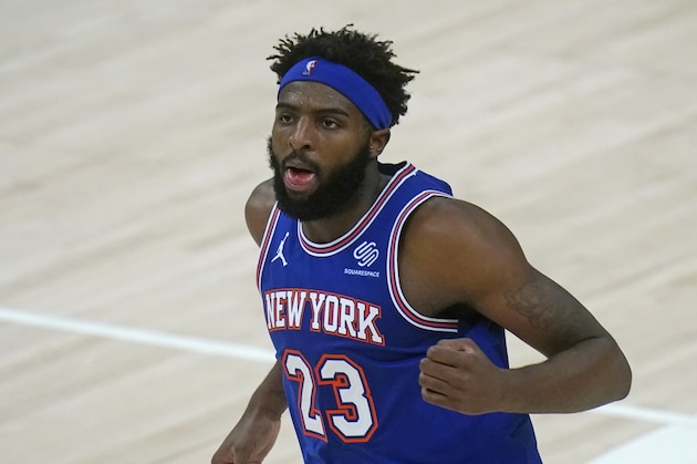 New York Knicks center Mitchell Robinson (23) defends in the second half during an NBA basketball game against the Utah Jazz Tuesday, Jan. 26, 2021, in Salt Lake City. (AP Photo/Rick Bowmer)