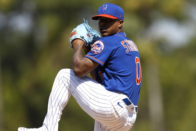 New York Mets pitcher Marcus Stroman warms up prior to a spring training baseball game against the St. Louis Cardinals, Wednesday, March 4, 2020, in Port St. Lucie, Fla. (AP Photo/Julio Cortez)
