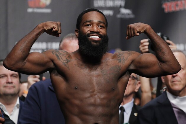 Adrien Broner poses on the scale during a weigh-in Friday, Jan. 18, 2019, in Las Vegas. Broner is scheduled to fight Manny Pacquiao in a welterweight championship boxing bout Saturday. (AP Photo/John Locher)
