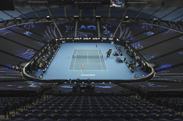 United States' Serena Williams and Romania's Simona Halep play their quarterfinal match on Rod Laver Arena at the Australian Open tennis championship in Melbourne, Australia, Tuesday, Feb. 16, 2021.(AP Photo/Andy Brownbill)