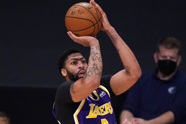 Los Angeles Lakers forward Anthony Davis shoots during the first half of an NBA basketball game against the Memphis Grizzlies Friday, Feb. 12, 2021, in Los Angeles. (AP Photo/Mark J. Terrill)