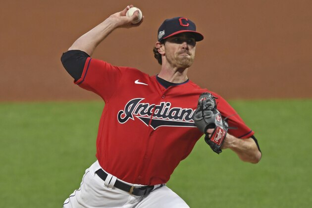 Cleveland Indians starting pitcher Shane Bieber (57) delivers in the first inning of Game 1 of an American League wild-card baseball series against the New York Yankees, Tuesday, Sept. 29, 2020, in Cleveland. (AP Photo/David Dermer)