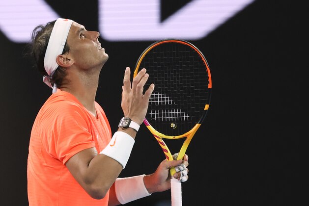 Spain's Rafael Nadal reacts after losing a point against Greece's Stefanos Tsitsipas during their quarterfinal match at the Australian Open tennis championship in Melbourne, Australia, Wednesday, Feb. 17, 2021.(AP Photo/Hamish Blair)