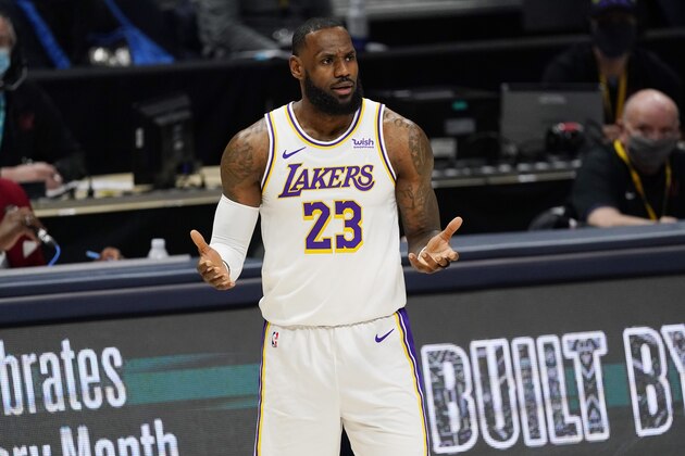 Los Angeles Lakers forward LeBron James questions a call during the first half of the team's NBA basketball game against the Denver Nuggets on Sunday, Feb. 14, 2021, in Denver. (AP Photo/David Zalubowski)