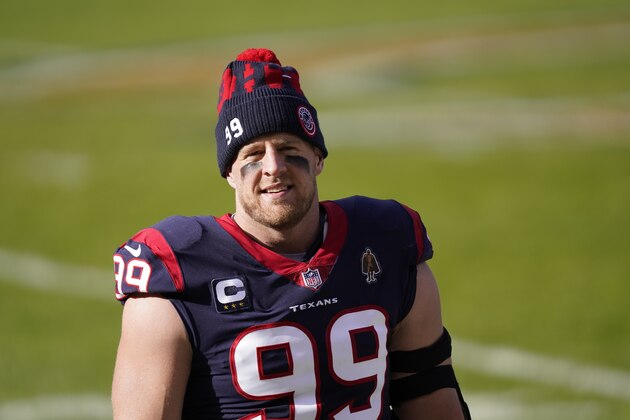 Houston Texans' J.J. Watt (99) watches before an NFL football game against the Chicago Bears, Sunday, Dec. 13, 2020, in Chicago. (AP Photo/Charles Rex Arbogast)