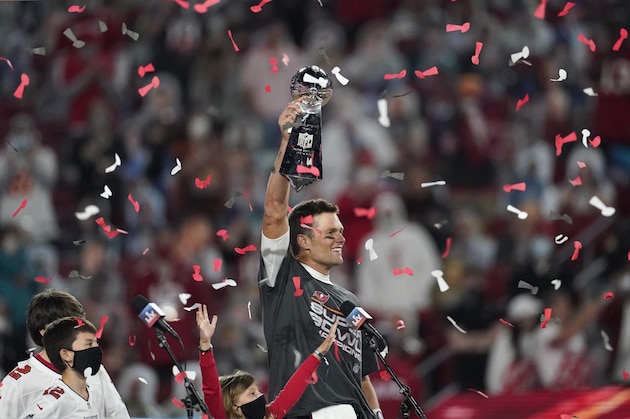 Tampa Bay Buccaneers quarterback Tom Brady holds up the Vince Lombardi trophy after defeating the Kansas City Chiefs in the NFL Super Bowl 55 football game Sunday, Feb. 7, 2021, in Tampa, Fla. The Buccaneers defeated the Chiefs 31-9 to win the Super Bowl. (AP Photo/Ashley Landis)