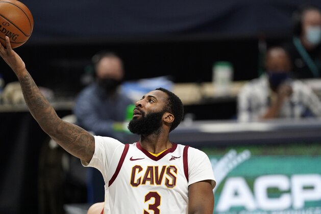 Cleveland Cavaliers center Andre Drummond, front, drives to the rim past Denver Nuggets center Nikola Jokic in the second half of an NBA basketball game Wednesday, Feb. 10, 2021, in Denver. (AP Photo/David Zalubowski)