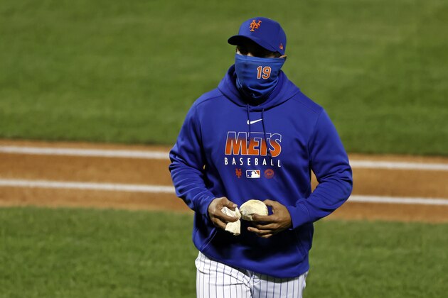New York Mets manager Luis Rojas walks back to the dugout during the third inning of a baseball game against the Atlanta Braves on Friday, Sept. 18, 2020, in New York. (AP Photo/Adam Hunger)
