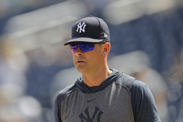 New York Yankees manager Aaron Boone looks on prior to a spring training baseball game against the Washington Nationals, Thursday, March 12, 2020, in West Palm Beach, Fla. (AP Photo/Julio Cortez)