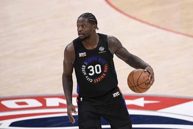 New York Knicks forward Julius Randle (30) dribbles the ball during the second half of an NBA basketball game against the Washington Wizards, Friday, Feb. 12, 2021, in Washington. (AP Photo/Nick Wass)