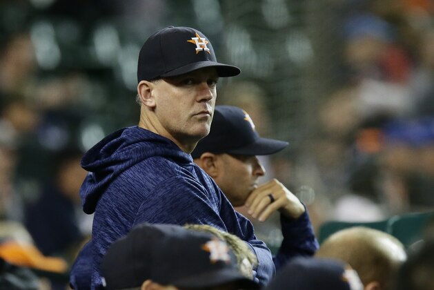 Houston Astros manager AJ Hinch watches from the dugout during the ninth inning of a baseball game against the Detroit Tigers Monday, Sept. 10, 2018, in Detroit. (AP Photo/Duane Burleson)