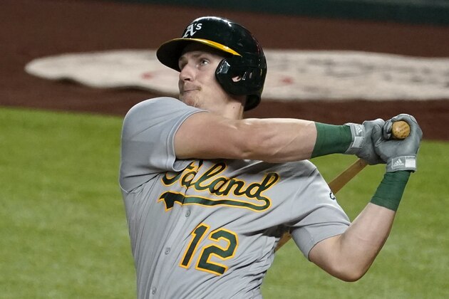 Oakland Athletics' Sean Murphy follows through on a swing during a baseball game against the Texas Rangers in Arlington, Texas, Wednesday, Aug. 26, 2020. (AP Photo/Tony Gutierrez)