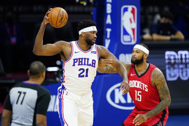 Philadelphia 76ers' Joel Embiid (21) tries to get past Houston Rockets' DeMarcus Cousins (15) during the first half of an NBA basketball game, Wednesday, Feb. 17, 2021, in Philadelphia. (AP Photo/Matt Slocum)