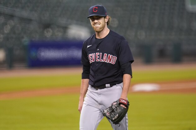 Cleveland Indians pitcher Shane Bieber smiles walking to the dugout in the fourth inning of a baseball game against the Detroit Tigers in Detroit, Thursday, Sept. 17, 2020. (AP Photo/Paul Sancya)