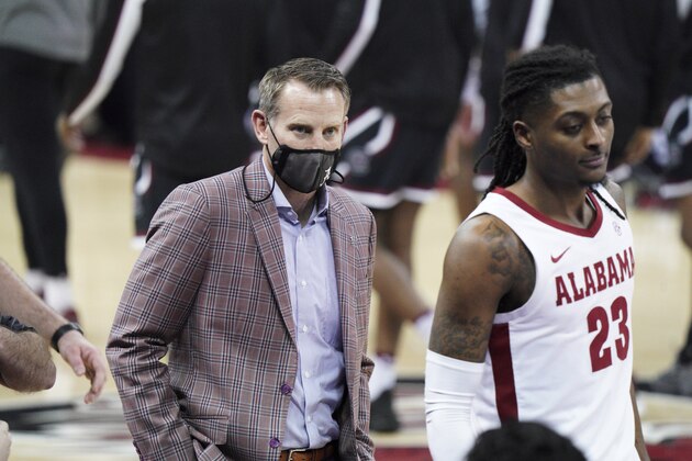 Alabama head coach Nate Oats walks across the court with John Petty Jr. (23) before an NCAA college basketball game against South Carolina Tuesday, Feb. 9, 2021, in Columbia, S.C. Alabama won 81-78. (AP Photo/Sean Rayford)