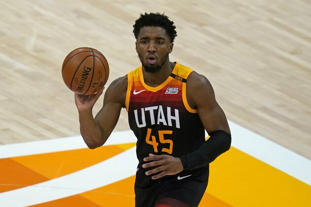 Utah Jazz guard Donovan Mitchell brings the ball up court in the second half during an NBA basketball game against the Philadelphia 76ers Monday, Feb. 15, 2021, in Salt Lake City. (AP Photo/Rick Bowmer)