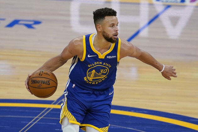 Golden State Warriors guard Stephen Curry dribbles the ball up the court against the Cleveland Cavaliers during the first half of an NBA basketball game in San Francisco, Monday, Feb. 15, 2021. (AP Photo/Jeff Chiu)