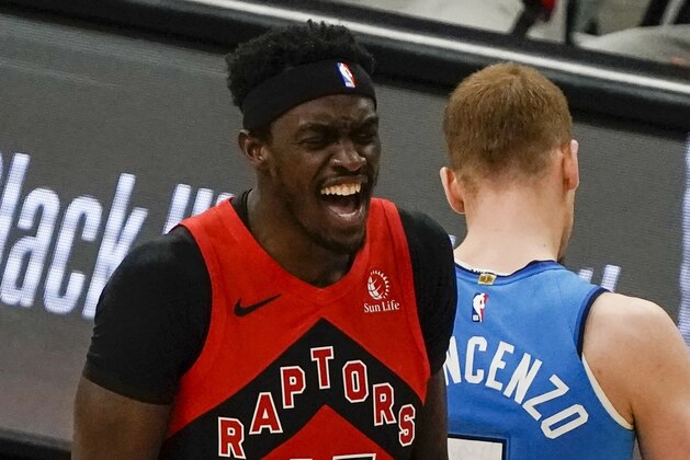 Toronto Raptors' Pascal Siakam reacts after making a basket and being fouled during the first half of an NBA basketball game against the Milwaukee Bucks Thursday, Feb. 18, 2021, in Milwaukee. (AP Photo/Morry Gash)