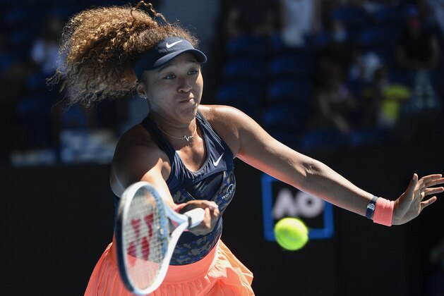 Japan's Naomi Osaka hits a forehand return to United States' Serena Williams during their semifinal match at the Australian Open tennis championship in Melbourne, Australia, Thursday, Feb. 18, 2021.(AP Photo/Andy Brownbill)
