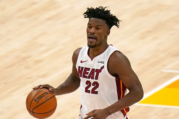 Miami Heat forward Jimmy Butler (22) brings the ball up court in the second half during an NBA basketball game against the Utah Jazz Saturday, Feb. 13, 2021, in Salt Lake City. (AP Photo/Rick Bowmer)