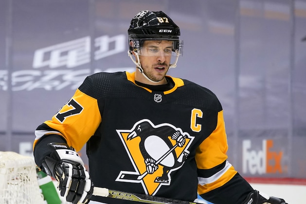 Pittsburgh Penguins' Sidney Crosby prepares to take a face-off during the second period of an NHL hockey game against the New York Rangers in Pittsburgh, Sunday, Jan. 24, 2021. (AP Photo/Gene J. Puskar)