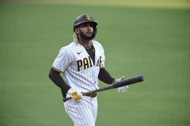 San Diego Padres' Fernando Tatis Jr. (23) bats during the first inning of a baseball game against the Seattle Mariners Saturday, Sept. 19, 2020, in San Diego. (AP Photo/Denis Poroy)