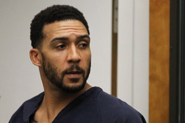 FILE - In this June 15, 2018, file photo, former NFL football player Kellen Winslow Jr., center, leaves his arraignment in Vista, Calif. Winslow, a former NFL No. 1 draft pick and son of a Hall of Famer who starred for his hometown San Diego Chargers, goes on trial Monday, May 20, 2019, on multiple charges including raping two women last year and raping an unconscious 17-year-old girl. He has pleaded not guilty to all charges.(Hayne Palmour/San Diego Union-Tribune via AP, Pool, File)
