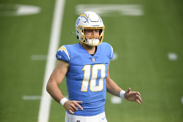 Los Angeles Chargers quarterback Justin Herbert warms up before an NFL football game against the Denver Broncos Sunday, Dec. 27, 2020, in Inglewood, Calif. (AP Photo/Kelvin Kuo)