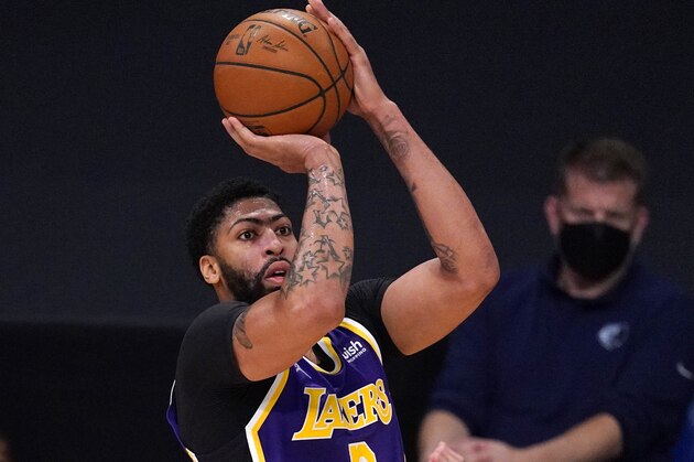 Los Angeles Lakers forward Anthony Davis shoots during the first half of an NBA basketball game against the Memphis Grizzlies Friday, Feb. 12, 2021, in Los Angeles. (AP Photo/Mark J. Terrill)