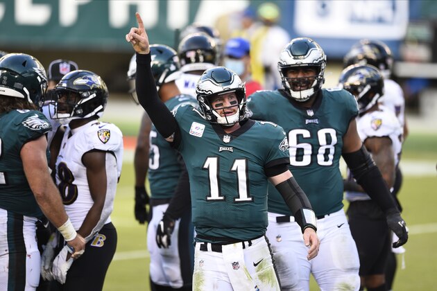 Philadelphia Eagles' Carson Wentz celebrates after scoring a touchdown during the second half of an NFL football game against the Baltimore Ravens, Sunday, Oct. 18, 2020, in Philadelphia. (AP Photo/Derik Hamilton)