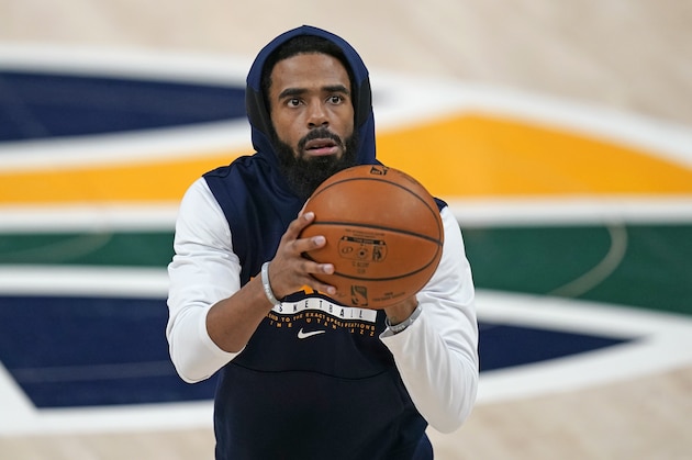 Utah Jazz guard Mike Conley warms up before their NBA basketball game against the Milwaukee Bucks Friday, Feb. 12, 2021, in Salt Lake City. (AP Photo/Rick Bowmer)