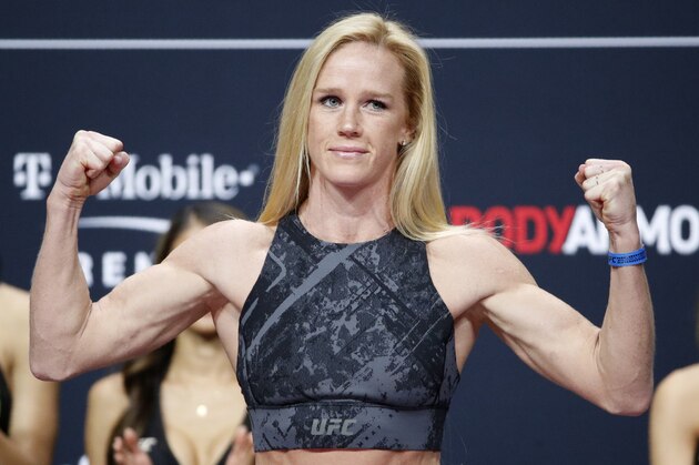Holly Holm poses during a ceremonial weigh-in for the UFC 246 mixed martial arts bout, Friday, Jan. 17, 2020, in Las Vegas. Holm is scheduled to fight Raquel Pennington in a women's bantamweight bout Saturday in Las Vegas (AP Photo/John Locher)