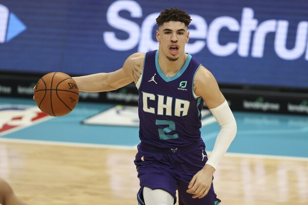 Charlotte Hornets guard LaMelo Ball runs the offense during the first half of an NBA basketball game against the San Antonio Spurs in Charlotte, N.C., Sunday, Feb. 14, 2021. (AP Photo/Nell Redmond)