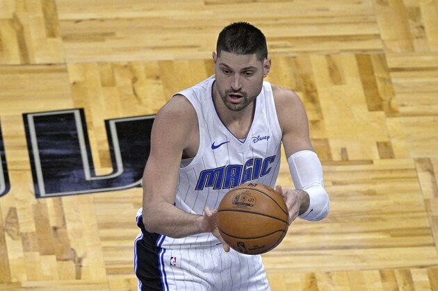 Orlando Magic center Nikola Vucevic passes the ball during the first half of an NBA basketball game against the New York Knicks, Wednesday, Feb. 17, 2021, in Orlando, Fla. (AP Photo/Phelan M. Ebenhack)