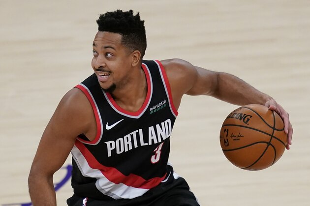 Portland Trail Blazers guard CJ McCollum (3) takes the ball down the court during the fourth quarter of an NBA basketball game against the Los Angeles Lakers Monday, Dec 28, 2020, in Los Angeles. (AP Photo/Ashley Landis)