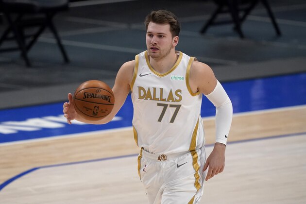 Dallas Mavericks' Luka Doncic advances the ball against the New Orleans Pelicans during an NBA basketball game in Dallas, Friday, Feb. 12, 2021. (AP Photo/Tony Gutierrez)