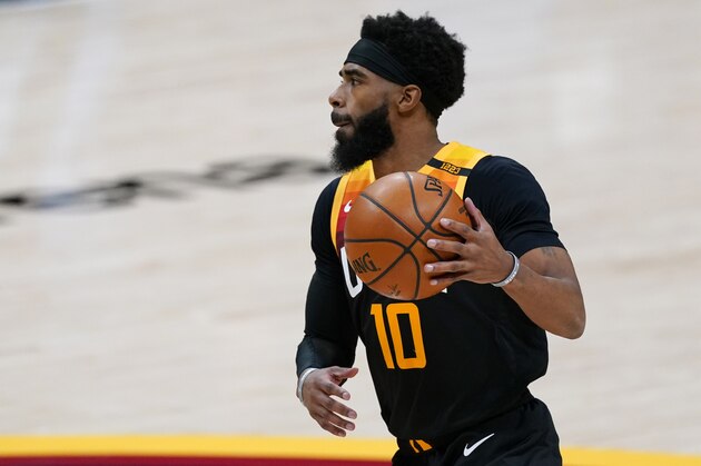 Utah Jazz guard Mike Conley (10) in the first half of an NBA basketball game Sunday, Jan. 31, 2021, in Denver. (AP Photo/David Zalubowski)