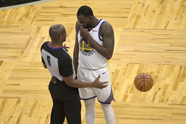 Golden State Warriors forward Draymond Green talks with official Tony Brown (6) during the second half of an NBA basketball game against the Orlando Magic, Friday, Feb. 19, 2021, in Orlando, Fla. (AP Photo/Phelan M. Ebenhack)