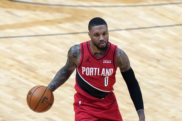 Portland Trail Blazers guard Damian Lillard (0) moves the ball up court in the first half of an NBA basketball game against the New Orleans Pelicans in New Orleans, Wednesday, Feb. 17, 2021. (AP Photo/Gerald Herbert)
