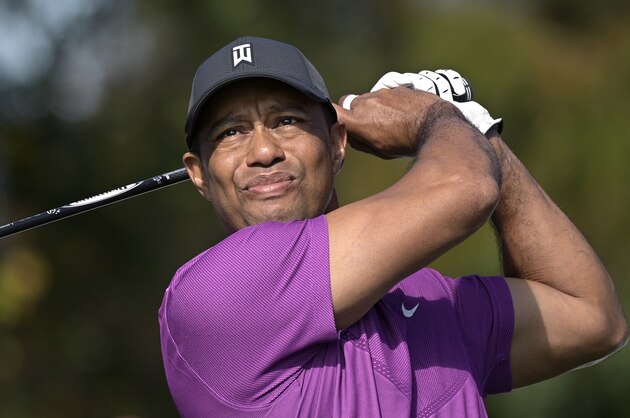 Tiger Woods watches his tee shot on the first hole during the first round of the PNC Championship golf tournament, Saturday, Dec. 19, 2020, in Orlando, Fla. (AP Photo/Phelan M. Ebenhack)