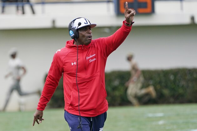 Jackson State football coach Deion Sanders calls out to his players during the first half of an NCAA college football against Edward Waters in Jackson, Miss., Sunday, Feb. 21, 2021. The game marks Sanders's collegiate head coaching debut. (AP Photo/Rogelio V. Solis) Jackson State football coach Deion Sanders calls out to his players during the first half of an NCAA college football against Edward Waters in Jackson, Miss., Sunday, Feb. 21, 2021. The game marks Sanders's collegiate head coaching debut. (AP Photo/Rogelio V. Solis)