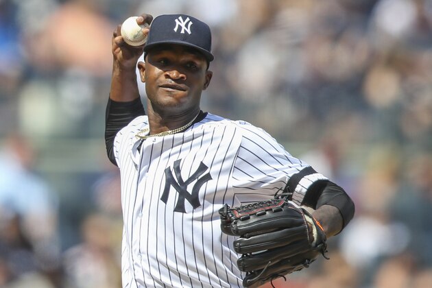 FILE - This is an Aug. 31, 2019, file photo showing New York Yankees pitcher Domingo German throwing to first in a pickoff attempt during the fifth inning of a baseball game against the Oakland Athletics, in New York. Yankees star pitcher Domingo Germán has been placed on administrative leave by Major League Baseball because of domestic violence. MLB did not give details in its statement Thursday, Sept. 19, 2019, but said the leave