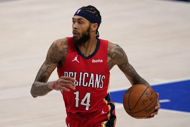 New Orleans Pelicans' Brandon Ingram advances the ball up court against the Dallas Mavericks during an NBA basketball game in Dallas, Friday, Feb. 12, 2021. (AP Photo/Tony Gutierrez)