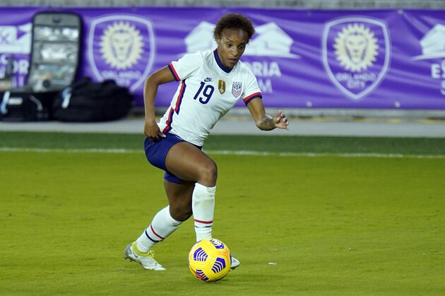 FILE - United States defender Crystal Dunn (19) moves the ball against Colombia during the second half of an international friendly soccer match in Orlando, Fla., in this Monday, Jan. 18, 2021, file photo. The 28-year-old U.S. national team defender has grown more confident in her abilities and her status on the U.S. women’s national team. She’s also become empowered in her activism as a Black woman. So much so that she even proclaimed herself the