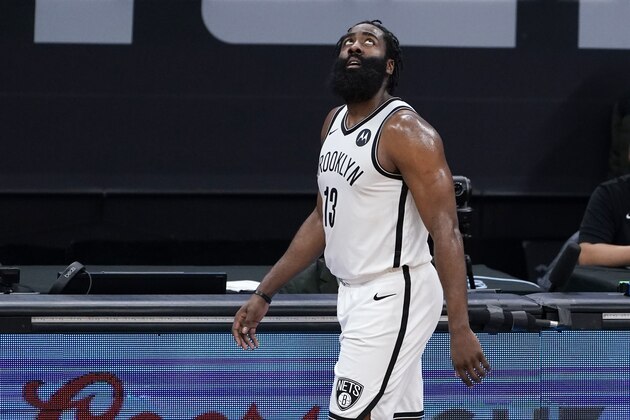 Brooklyn Nets guard James Harden looks up at the scoreboard as he comes out of the game during the second half of an NBA basketball game against the Sacramento Kings in Sacramento, Calif., Monday, Feb. 15, 2021. The Nets won 136-125. (AP Photo/Rich Pedroncelli)