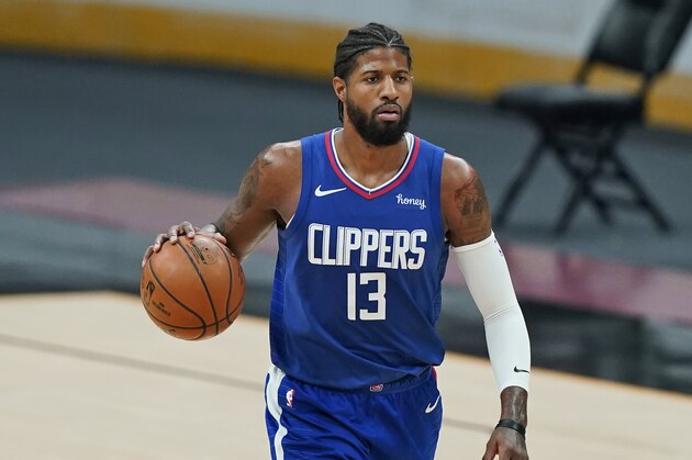 Los Angeles Clippers' Paul George drives in the second half of an NBA basketball game against the Cleveland Cavaliers, Wednesday, Feb. 3, 2021, in Cleveland. (AP Photo/Tony Dejak)