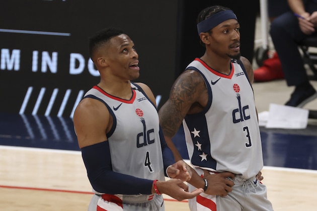 Washington Wizards guard Russell Westbrook (4) stands on the court with guard Bradley Beal (3) during the second quarter against the Orlando Magic in an NBA basketball game Saturday, Dec. 26, 2020, in Washington. (Geoff Burke/Pool Photo via AP)